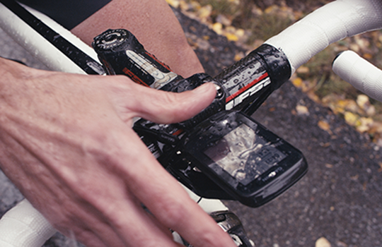 an electronic GPS attached to a bike working in the rain thanks to HZO's protective coatings